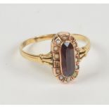 A 14ct yellow gold seed cultured pearl set oval dress ring with central red stone surrounded by a