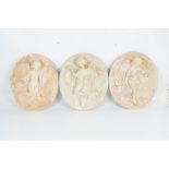 Three oval plaster plaques of musical child angels in relief, each approx height 41cm (one af).