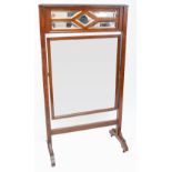 An Edwardian walnut rectangular dressing mirror with square bevelled plate,