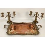 An early 20th century electroplated twin handled tray of rectangular form with cast foliate