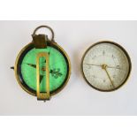 A 19th century brass circular pocket compass with ring loop attachment,