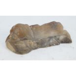 An alabaster carved ashtray in the form of a dog's head, length 25cm.