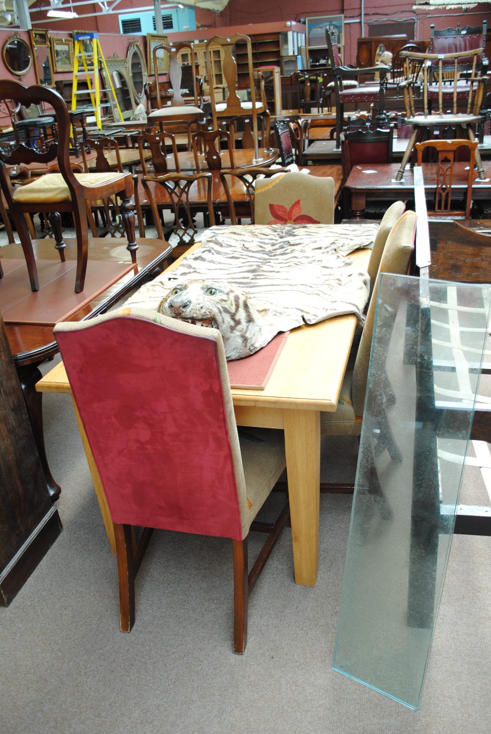 A rectangular dining table and four upholstered chairs (5).