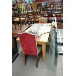 A rectangular dining table and four upholstered chairs (5).