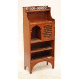 An Arts & Crafts free standing smoking cabinet, with turned bobbing gallery above shelf,