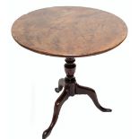 A George III mahogany tilt top table, with one-piece top to turned support and outswept tripod feet,