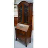 A 20th century oak bureau/bookcase with twin astragal glazed doors, width 75cm.