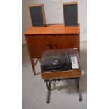 A retro teak twin-door record cabinet, width 76cm, containing a quantity of vinyl,