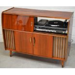 A retro teak-effect stereo cabinet,