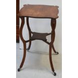 An Edwardian oak octagonal occasional side table with small lower shelf on curved tapering supports