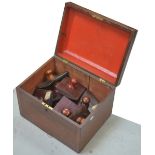 A large Victorian mahogany sarcophagus-shaped box, width 41cm and a quantity of wooden map rollers,