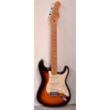 A Fender Stratocaster electric guitar with sunburst finish, serial number MZ5198321.