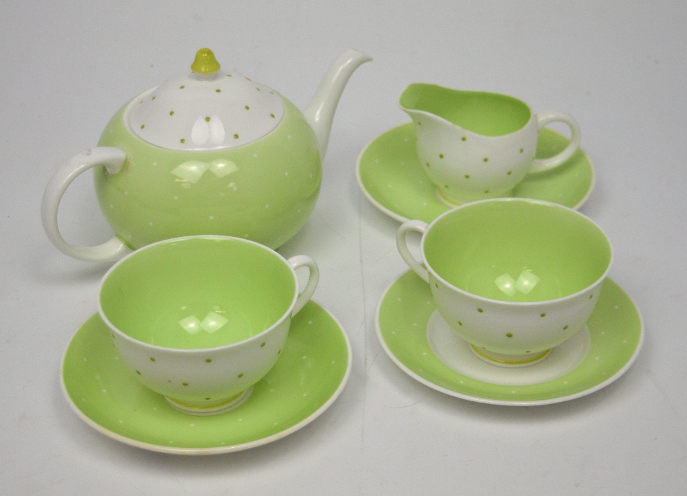 A Suzie Cooper design bone china polka dot tea service for two, comprising two cups and saucers,