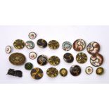 A good collection of enamelled buttons and a silver and enamel cat badge.