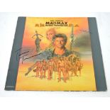 A signed record; 'Mad Max: Beyond Thunderdome',