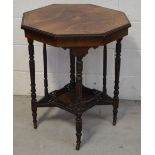 An Edwardian walnut veneer inlaid octagonal side table on turned supports with a lower gallery