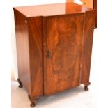 A mid-20th century tallboy, door to one side and three interior shelves,