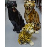 A large model of a tiger, a model of a tiger cub and a large model of a black panther,