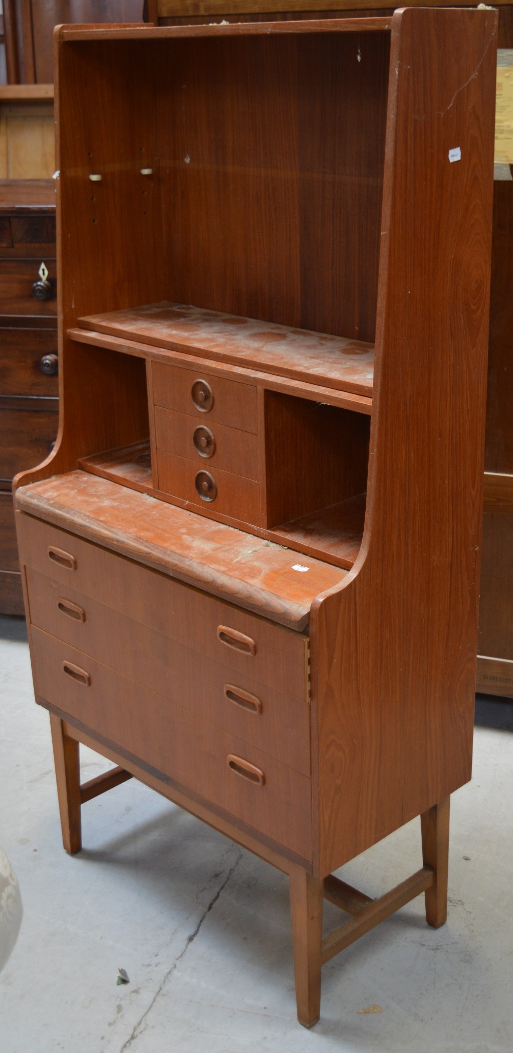 A retro teak six-drawer unit raised on square-section tapering legs, width 76cm.
