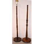 Two mahogany standard lamps, one on circular plinth base, the other on octagonal base,
