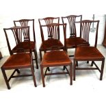 A set of six reproduction-style mahogany dining chairs,