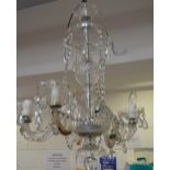 A 20th century English cut glass five-branch electrolier with cut glass drops,