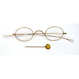 A boxed Victorian Continental 15ct gold stick pin and a pair of 9ct rose gold spectacles (2).