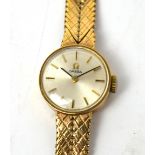 Omega; a ladies' 9ct yellow gold wristwatch on articulated 9ct strap,