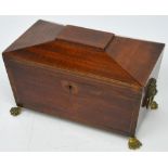 A 19th century mahogany sarcophagus tea caddy with original lead lining.