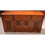 An Art Nouveau style oak sideboard,