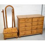 A modern pine cheval mirror with lower drawer (af) and a pine eight-drawer chest of drawers,