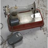 A Jones tabletop sewing machine, model C.M.D 66, with original instruction manual.