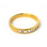 An 18ct yellow gold half-eternity ring with triangular diamonds set in rub-over settings, size N,