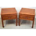 A pair of Oriental hardwood side tables with central drawer, on stylised Oriental feet, width 56cm.