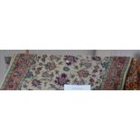 Three rugs to include two Persian-inspired examples, a geometric design on red and black ground,