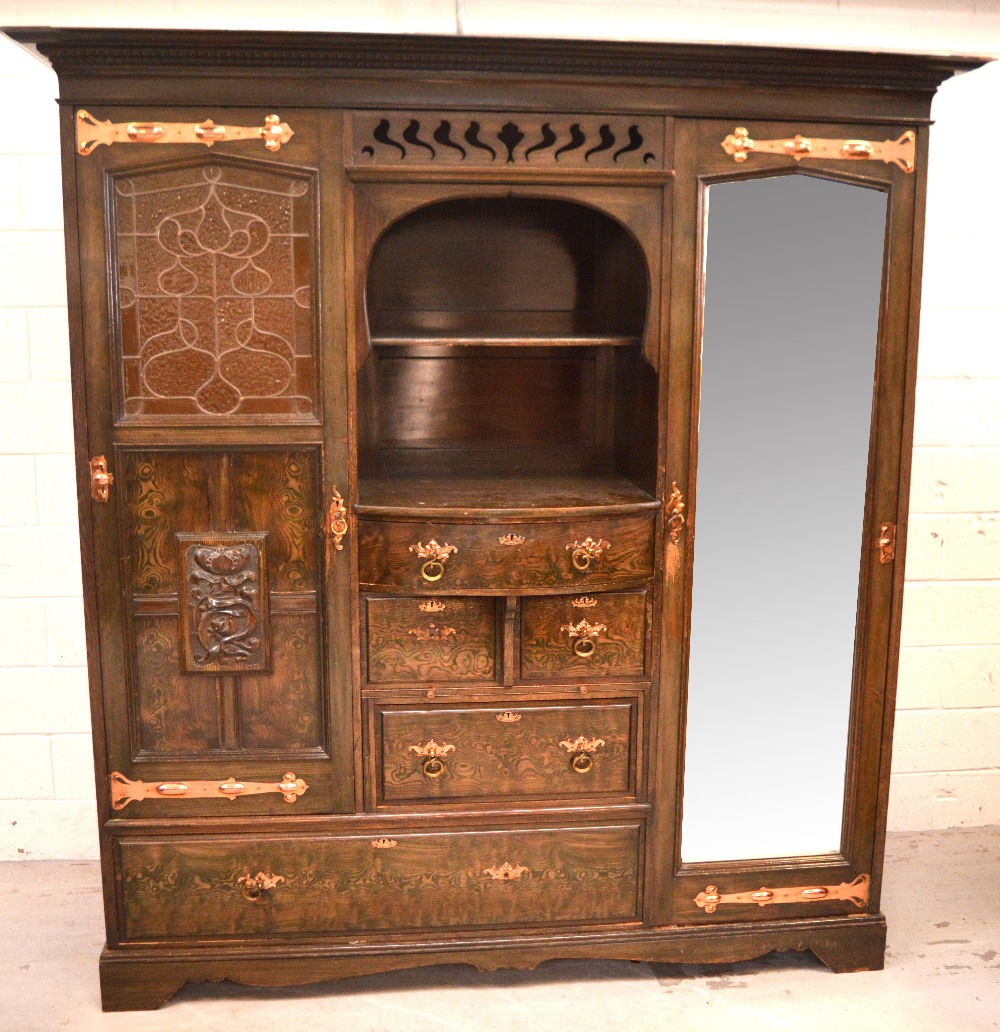 An early 20th century Arts and Crafts style stained pine two-door wardrobe, one mirrored door, - Image 2 of 4
