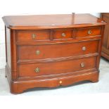 A Simon Horn mahogany bow-front chest, three small drawers over two long drawers,