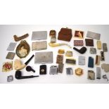 A collectors' lot comprising lighters to include Ronson, pipes to include a Meerschaum example,