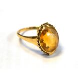 A 14ct gold dress ring set with oval and amber-coloured stone, size I, approx 2.5g.