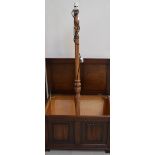 An oak blanket box of simple form, width 78cm and an oak standard lamp on carved circular support,
