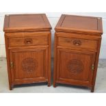 A pair of Oriental hardwood bedside cabinets,