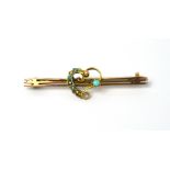 A 9ct yellow metal bar brooch with heart decoration, set with turquoise and seed pearls.