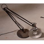 A retro black angle poise table lamp.