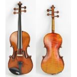 A German three quarter size violin, unlabelled, the two-piece back 33.4cm.
