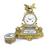A late 19th century French gilt metal eight day mantel clock surmounted with two cast birds,