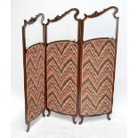 A early 20th century French three panel two fold screen with glazed scrolling upper section and