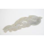 A Chinese carved grey jade stylised dragon plaque with incised decoration to both sides,