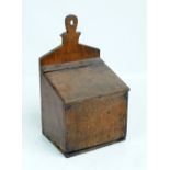 A late George III oak candle box with sloping hinged cover, width 23.5cm.