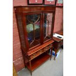 A reproduction inlaid mahogany display cabinet,