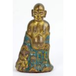 A Chinese late Qianlong/early Jiaqing gilt hollow metal figure of Lohan,